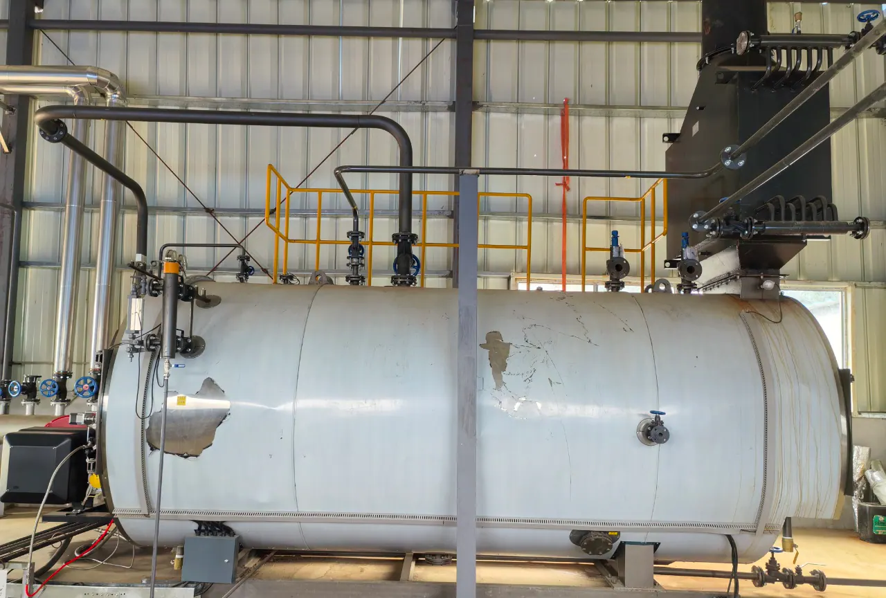 The boiler shell and steam drum after installation — the auxiliaries arrived pre-piped on skids.
